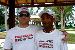 A member and the secretary general of Czech Greyhound Racing Federation under palms 